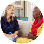 Social care worker speaks with client.